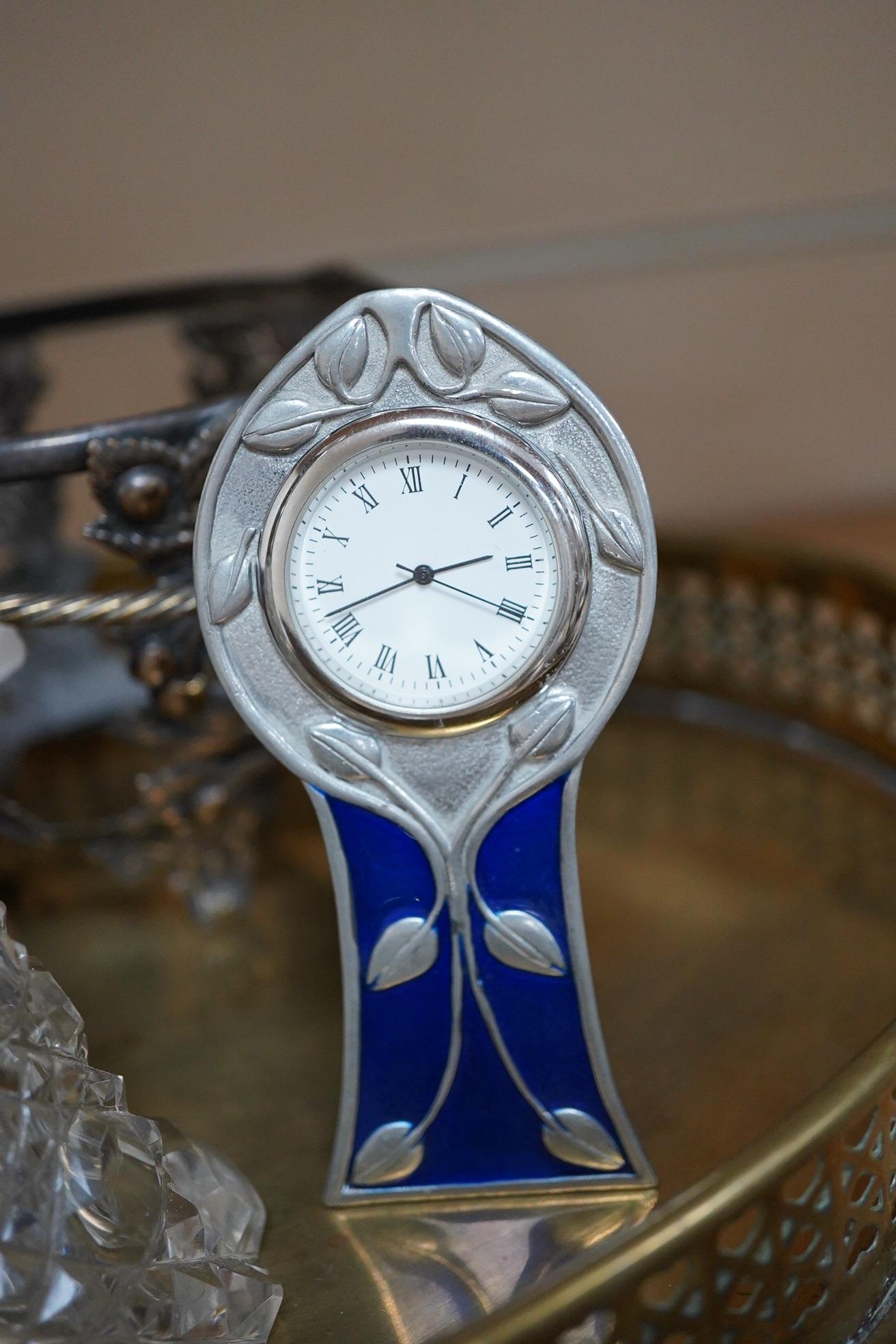 An Art Nouveau style enamelled timepiece by A. E. Williams, a small group of various plated wares and some small silver